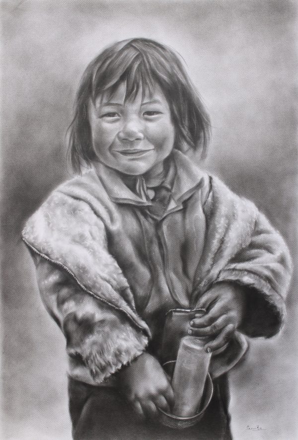 A smiling Tibetan girl